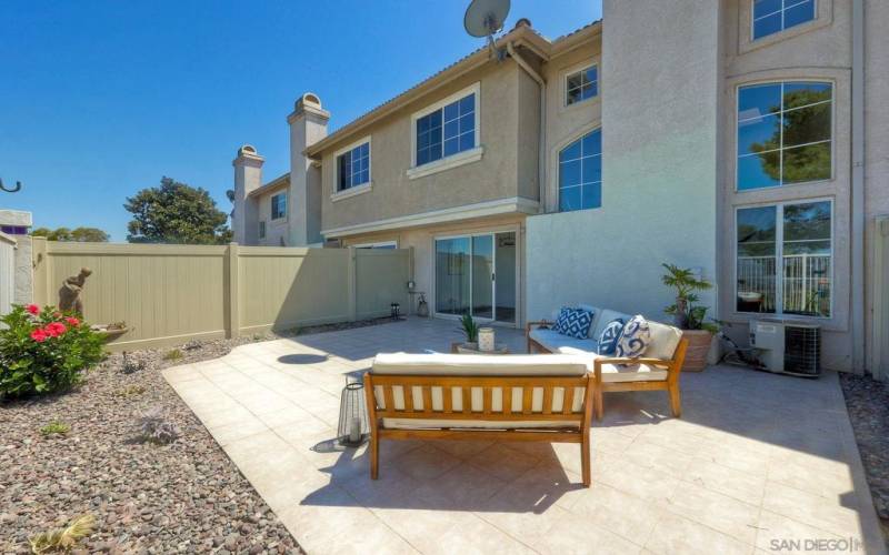 Private patio with new vinyl privacy fence