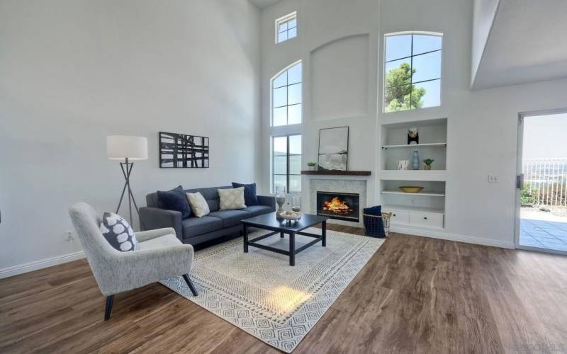 Living room with beautiful windows to bring in the natural light and cathedral ceilings