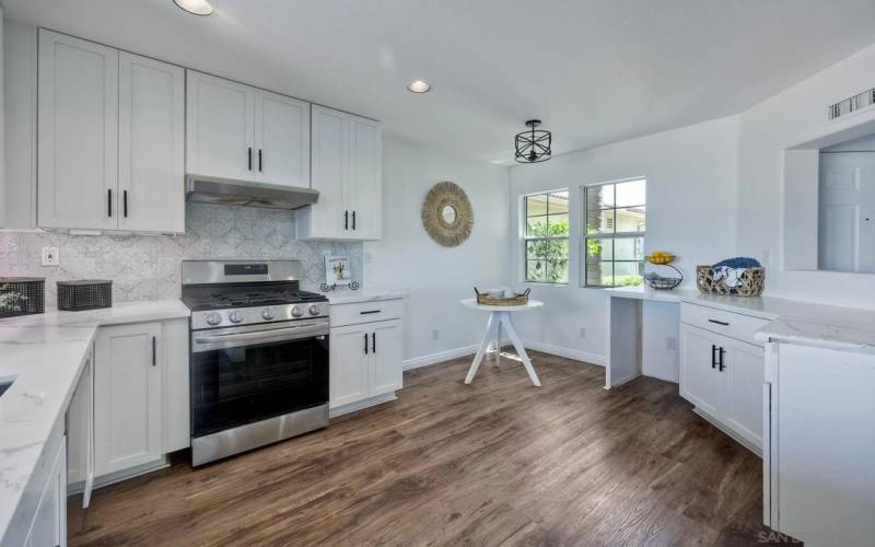 Recently remodeled kitchen with new cabinets and quartz countertops