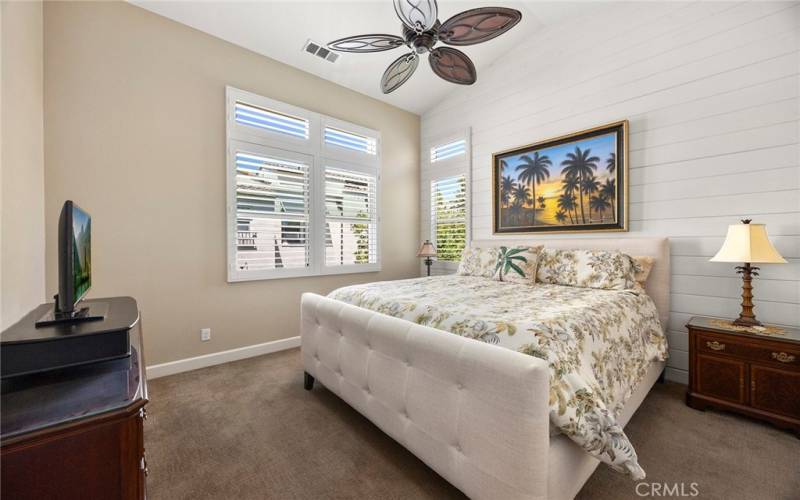 PRIMARY SUITE WITH VAULTED CEILING, CEILING FAN AND SHIPLAP WALL