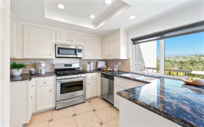 Kitchen with Gorgeous Black Marbled Granite and Lake Views