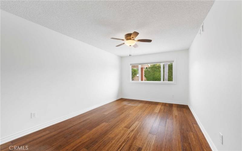 The first bedroom off the hallway is next to the living room