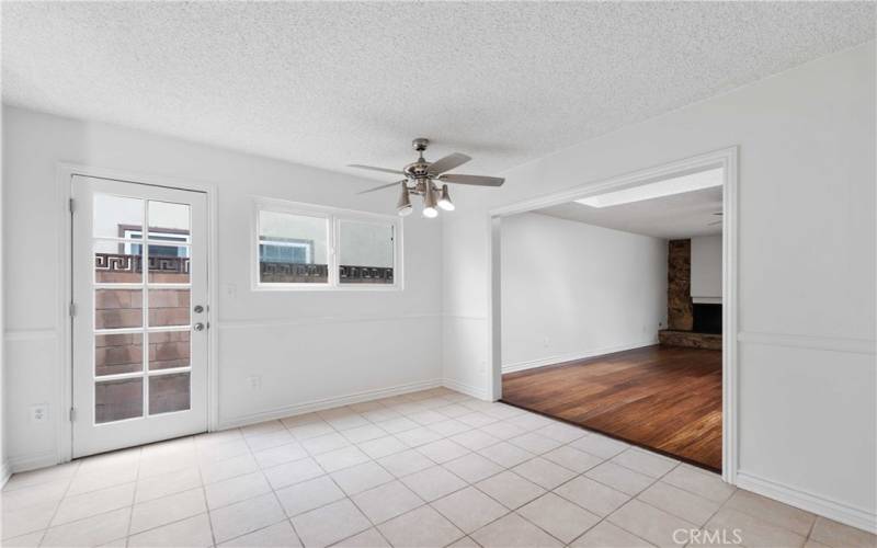 Kitchen opens to living room and boasts bright breakfast are with door to side yard