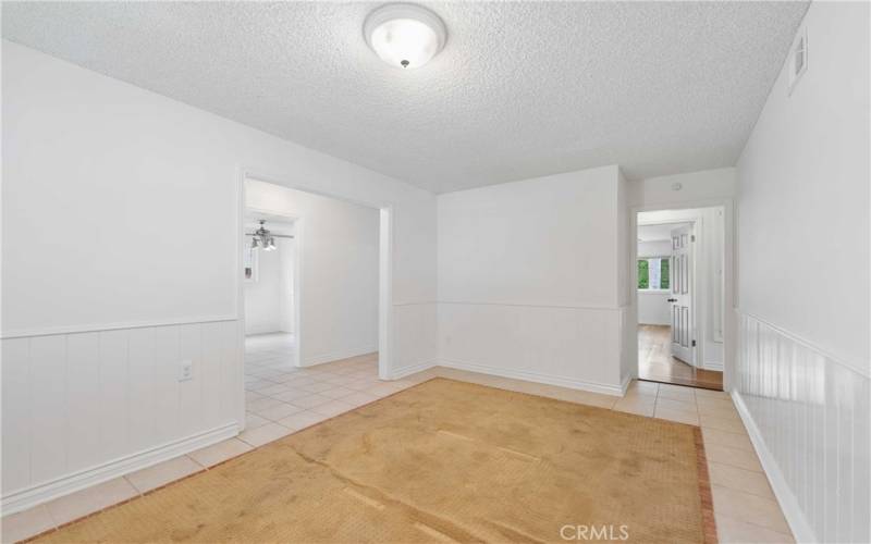 Dining Room in-laid rug can easily be replaced by room-sized carpet or tile flooring