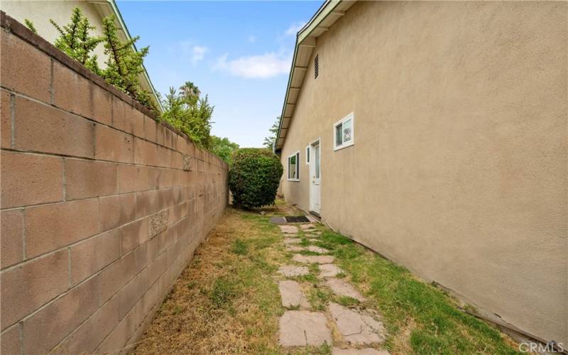 South side has walkway to bathroom - could make a dog run