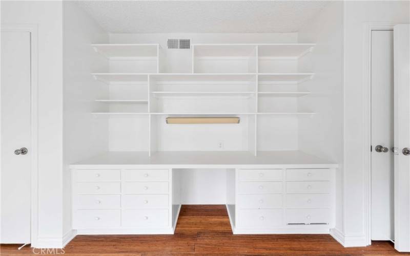 Great built ins for student desk or in home office with closets at each end