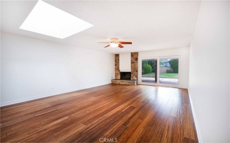 Living Room offers engineered Bamboo floors, skylight, fireplace, dual paned sliders to back yard