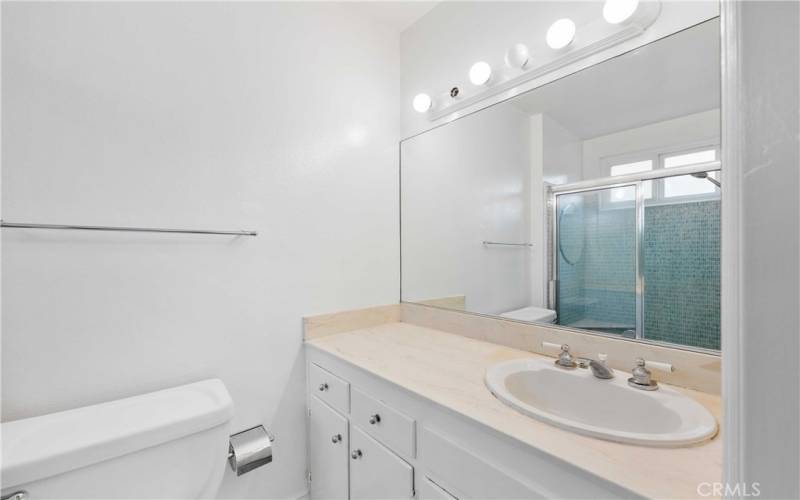 Wide vanity offers extra storage in 3/4 bathroom