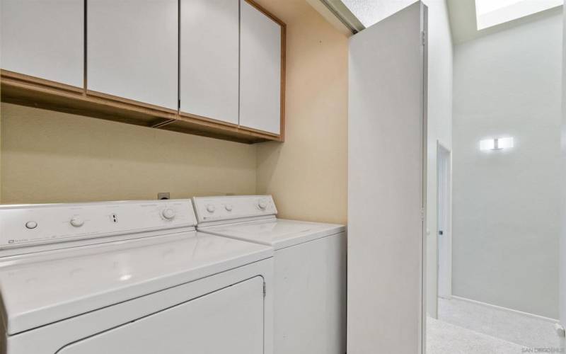 Full-size in-unit laundry centrally located in upstairs hallway closet