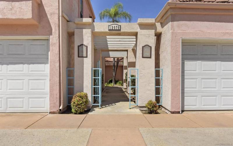 Attractive courtyard entry to the townhomes - unit's detached garage at right side