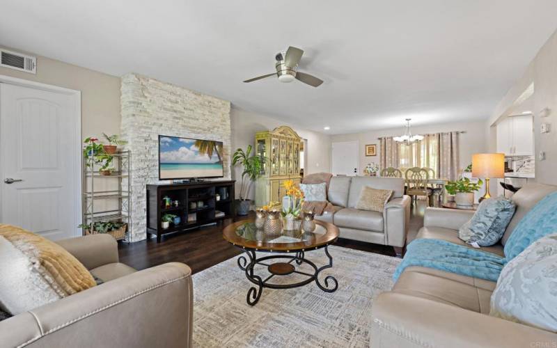 Living room has a sit down view of the golf course