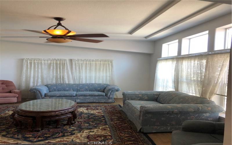 Living room with lovely tray ceiling.