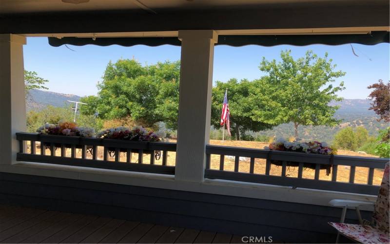 Large covered deck looks out toward mountain views.