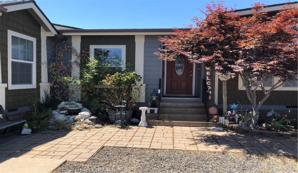 Home's front entrance with a nice water feature.