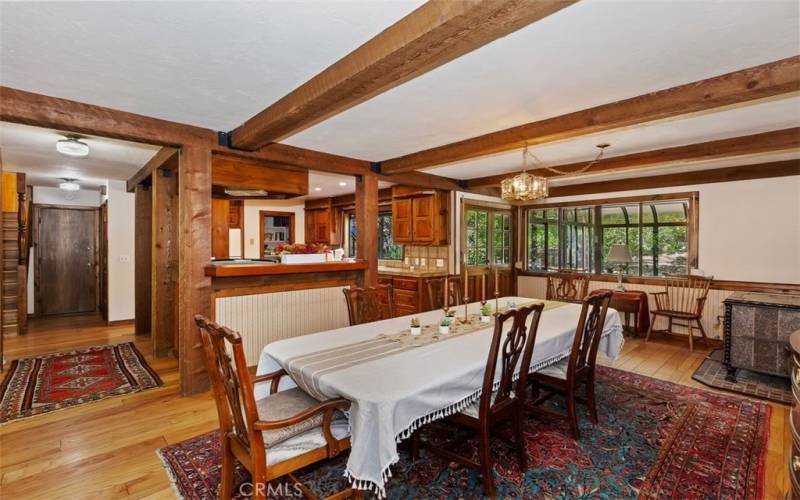 DINING ROOM, NOTE THE BEAUTIFUL NATURAL FLOORS AND NATURAL WOOD CABINETS