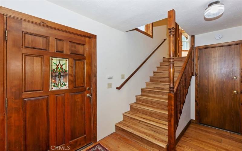 FRONT DOOR WITH STAIRCASE ENTRY TO FAMILY PRIVATE QUARTERS