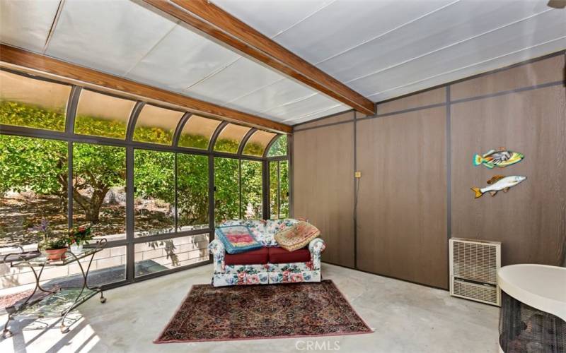 SUNROOM THAT LOOKS OUT TOWARD THE ORCHARD