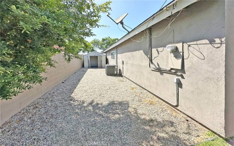 Lots of room in side yard with storage shed