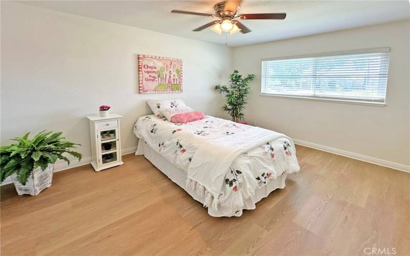 Bedroom with new flooring and paint.