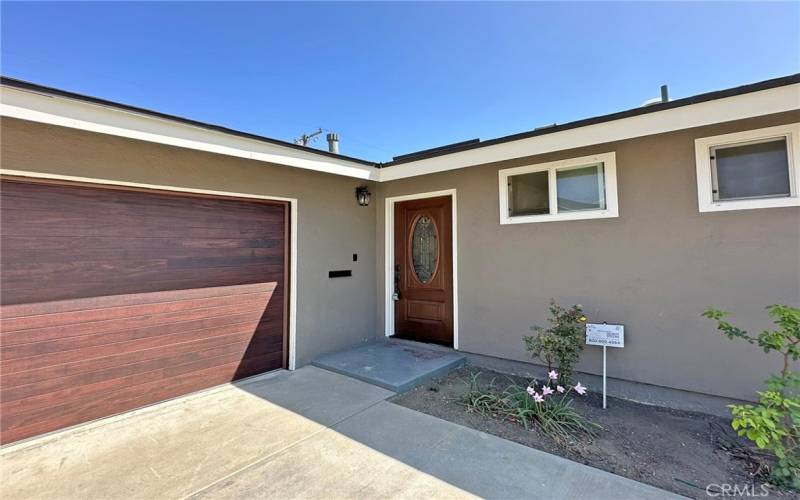 Wonderful front door with leaded glass welcomes you home and coordinates with brand new garage door