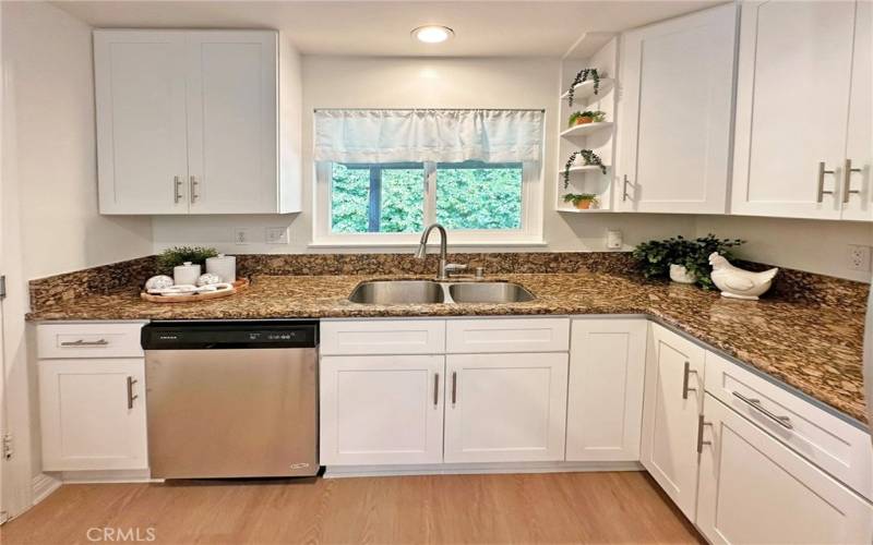 Elegant granite counters give lots of room for meal prep