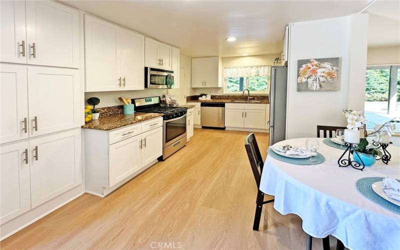 Remodeled kitchen has stainless steel appliances, gas stove , granite counter tops, soft close doors and cabinets, lots of storage, new floors and paint