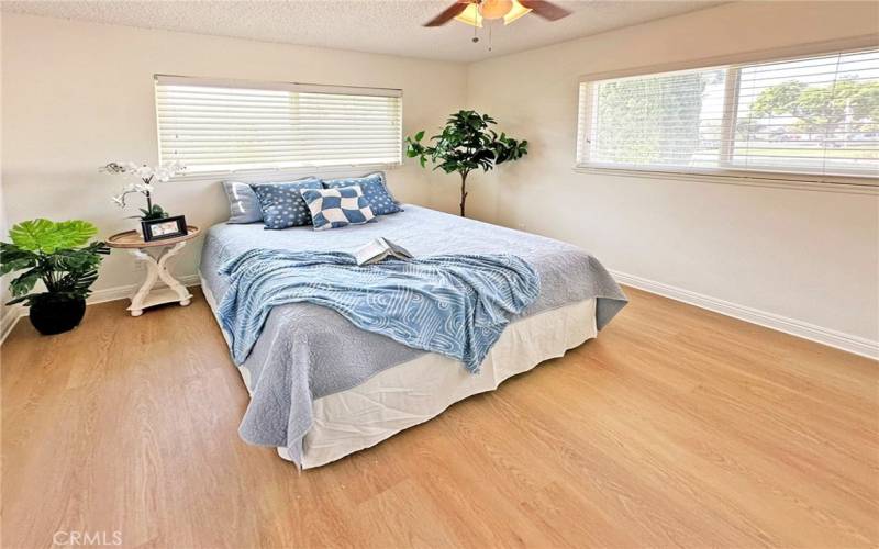 Primary Bedroom with new floors, paint gives a relaxing, retreat feel with an on-suite bathroom.