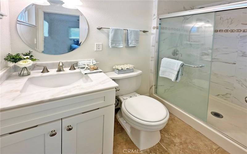 Primary on-suite bath is light and bright.