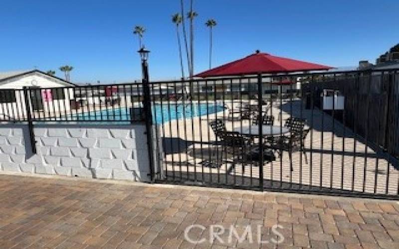 VIEW OF POOL AREA FACING NORTHEAST.