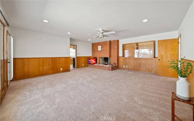 Huge family room opens to the kitchen and leads out to a large patio and spacious back yard