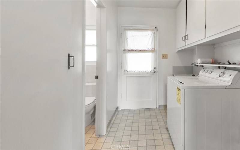 Laundry room with sink opens to back yard