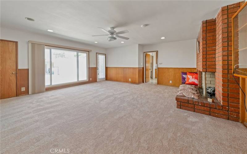 Family room with large picture window and door to back yard