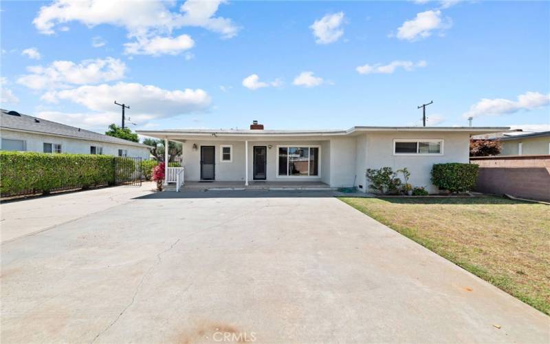 View to the rear of the house with the inviting covered patio - awesome party house!