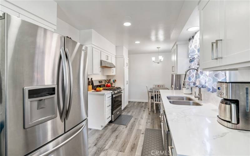 Beautifully Updated Kitchen with Granite Countertops and Recessed Lighting