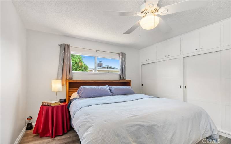 Bedroom with Luxury Vinyl Tile Flooring and Ceiling Fan