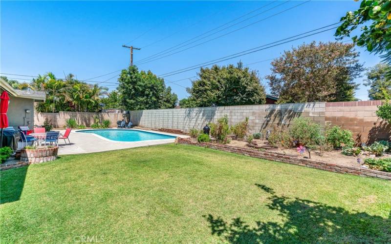 Rear Yard with Sparkling Pool and Vegetable Gardens