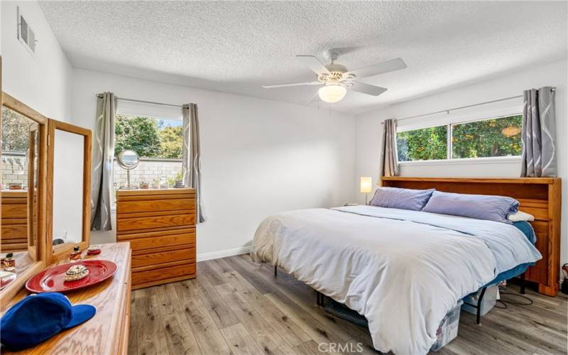 Bedroom with Luxury Vinyl Tile Flooring and Ceiling Fan