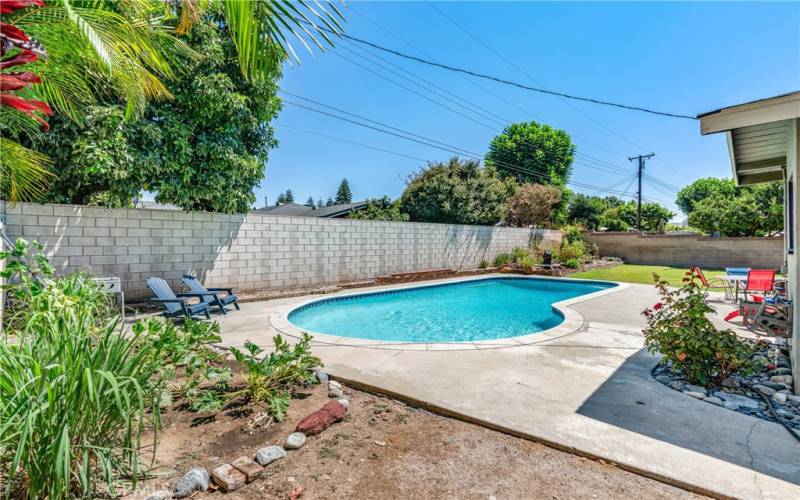 Rear Yard with Sparkling Pool and Vegetable Gardens