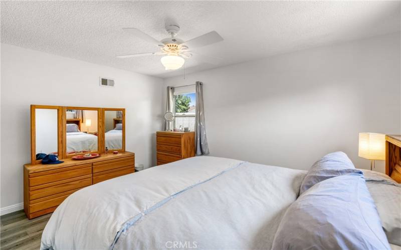 Bedroom with Luxury Vinyl Tile Flooring and Ceiling Fan