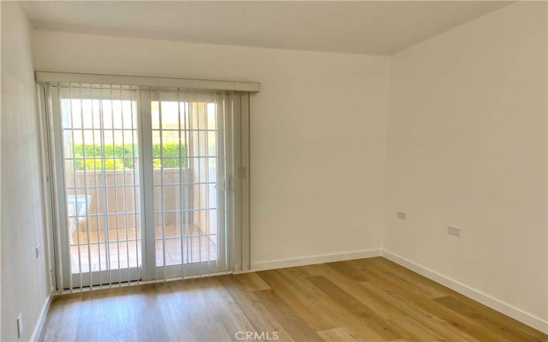 sliding door from bedroom next to bathroom, out to patio