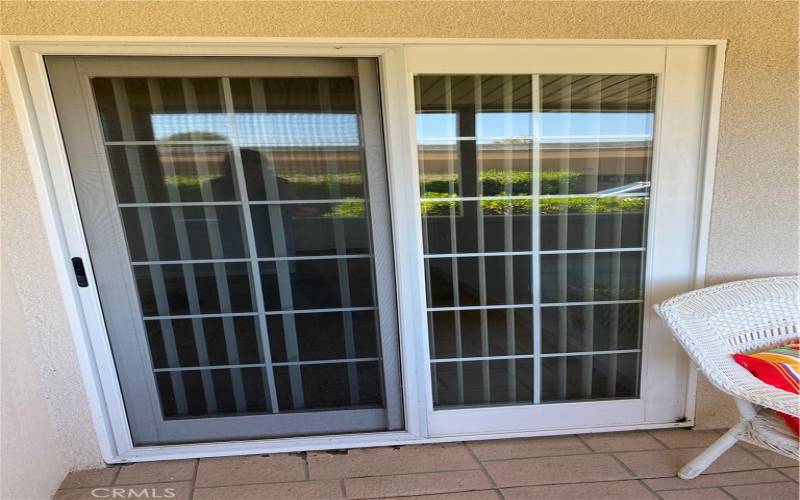 Sliding door from bedroom out to the front patio.