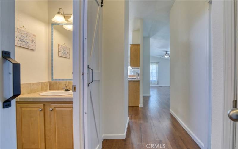 Hall bath with barn door closure