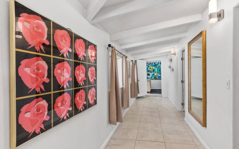 Hallway to bedrooms and den