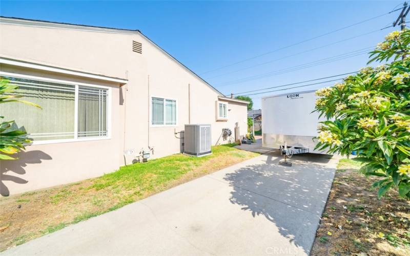 RV trailer parking in front of 2 car garage