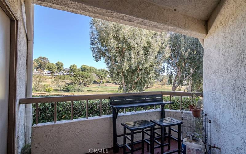 Back Patio with a breakfast nook overlooking a golf course.