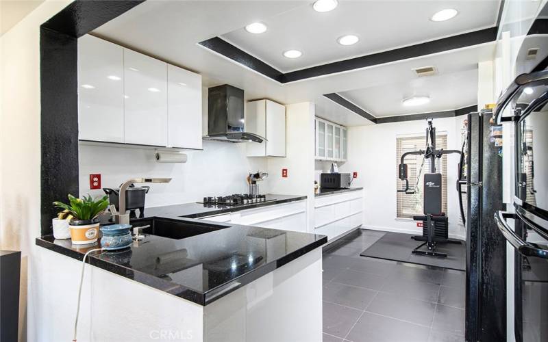 Remodeled kitchen with open layout and recessed lights