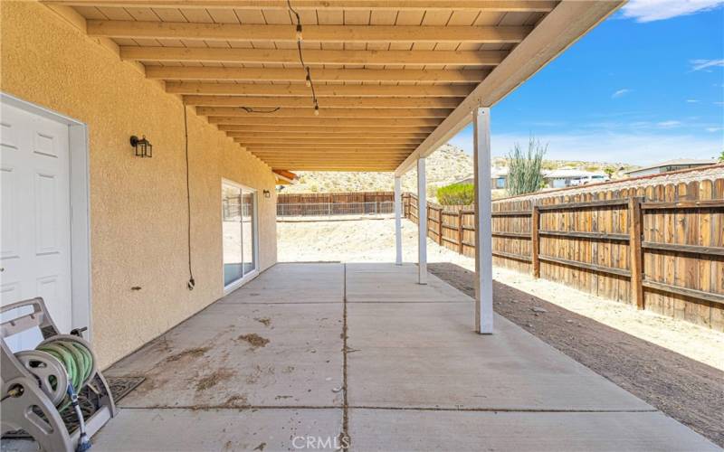 Full span patio runs across the back of the house.