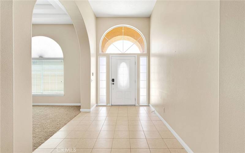 Bright entry that leads to  library room.