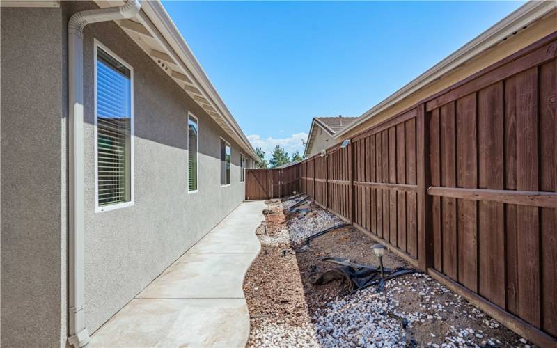 Side of the house also has concrete.