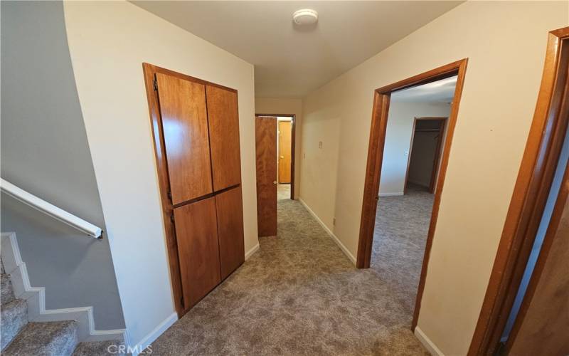 Hallway to additional bedrooms and Laundry